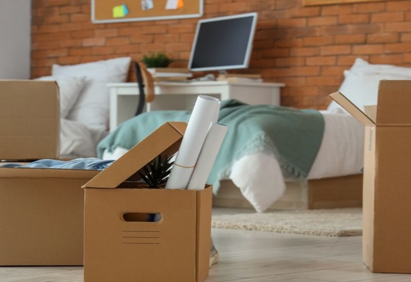 Student dorm with moving boxes